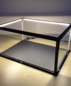 Acrylic Display Light Box. An acrylic display box with lighting is a type of display case that is made from acrylic, a type of plastic that is known for its transparency and durability. These boxes are designed to showcase and illuminate items, such as collectibles, jewelry, or other small objects. They usually come with built-in lighting, such as LED lights, that shine on the items inside, making them more visible and eye-catching. The acrylic material also makes it easy to create different shapes, sizes and forms to fit the needs of the objects to be displayed. The lighting can be built-in or attached to the sides, top or bottom of the box, depending on the design. This type of display box can be used in a variety of settings, such as retail stores, museums, and homes, and are often used for items that require special attention or protection.